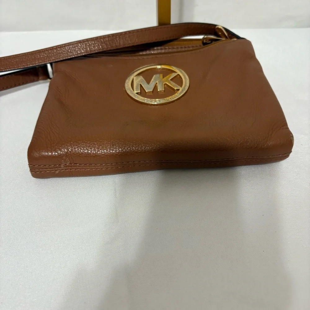 Michael Kors brown leather crossbody bag with gold-tone hardware